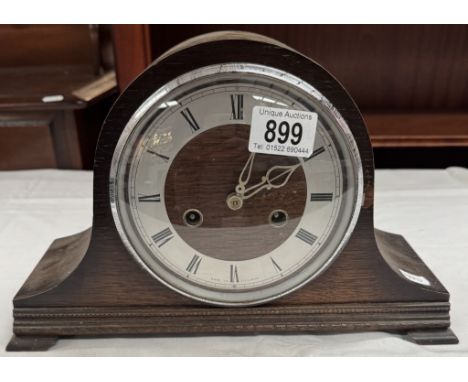 An oak mantle clock
