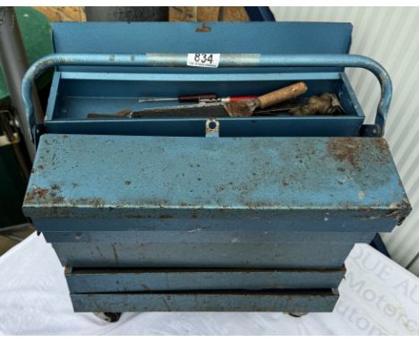 A metal toolbox with tools