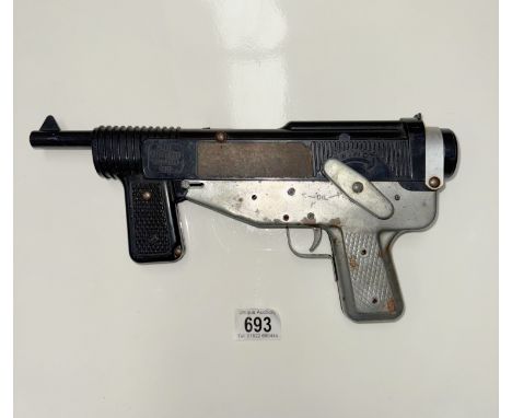 A rare vintage Mattel clockwork / Wind up machine cap gun