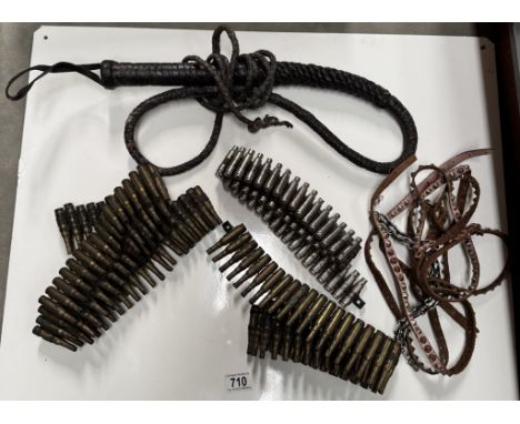 A quantity of machine gun belts &amp; A vintage whip