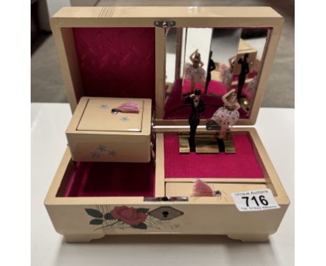 A vintage musical jewellery box