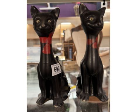 A pair of vintage long neck ceramic cat ornaments. Height 23.5cm