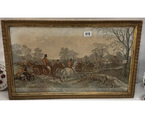 A gilt framed print of a hunting scene