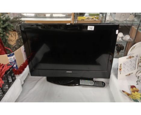 A Hitachi 26'' TV with remote