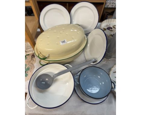 A good selection of vintage enamel kitchen ware including a large cooking pot