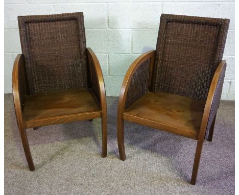 A pair of Loom rattan Colonial style armchairs, with bucket seats and a brown finish (2)Condition reportThe seat pads have be