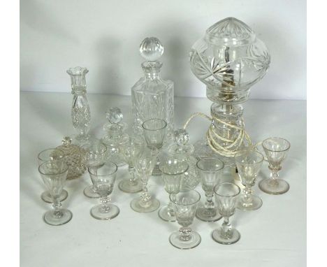 An assortment of table glassware, including a crystal glass covered table lamp, a candlestick, mallet form decanter and vario
