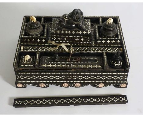 A fine Anglo Ceylonese ebony and bone dot writing stand, mid 19th century, possibly Matara,of rectangular form with an assort