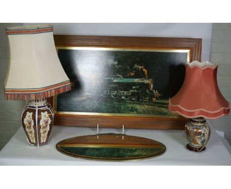 After Terrence Cuneo, King George V under steam, coloured print, 42x92cm, with two decorative lamps, and an oval mirror (4)