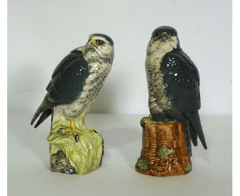 A pair of Royal Doulton ceramic decanters, in the form of Birds of Prey, filled by Beneagles Whisky, including a Peregrine Fa