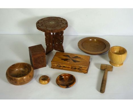 A small group of decorative carved wood objects, including five assorted turned bowls, a small caddy box and a trinket box (9
