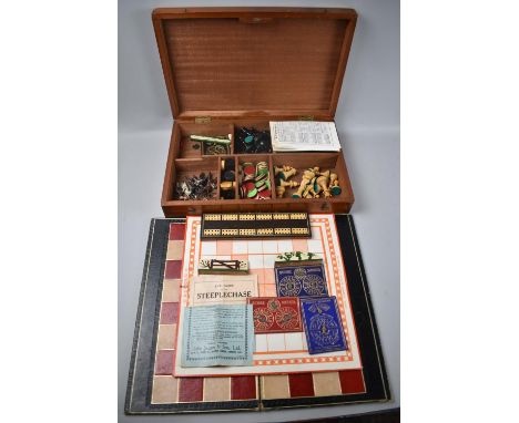 An Edwardian Mahogany Cased Games Compendium with Chess Pieces, Metal Racehorse, Whist Markers, Cribbage Board, Draughts Etc 