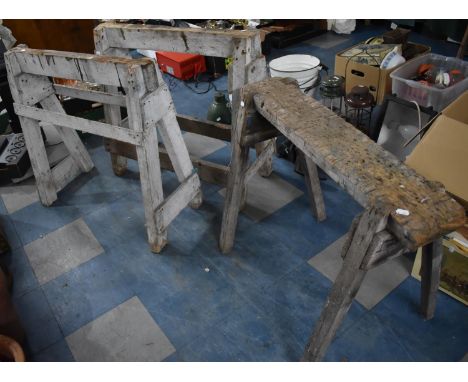 A Pair of Vintage Wooden Trestles Together with a Single Example 