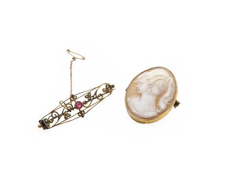 An antique seed pearl brooch and a shell cameo brooch, the first of open scrolling form with foliate trefoils set with seed p