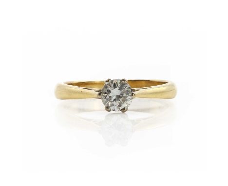 An 18ct gold single stone diamond ring, a round brilliant cut diamond, estimated as approximately 0.60ct, claw set to a white