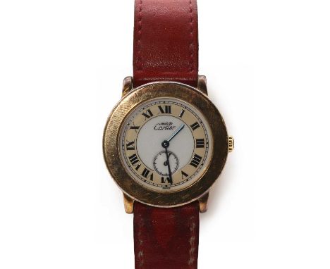 A silver gilt Must de Cartier quartz strap watch, reference 1810-1, with a circular case, 32mm diameter, a white and cream di