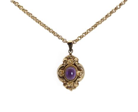 A 9ct gold amethyst pendant,an oval cabochon amethyst bezel set to a millegrain edge, with flower head accents at the compass