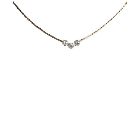 A gold three stone diamond necklace,the centrepiece comprising a bowed line of spectacle set round brilliant cut diamonds, wi