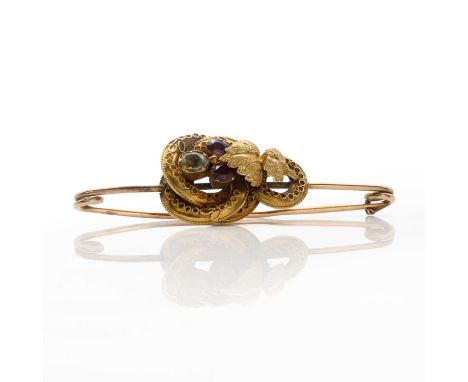 A Victorian foiled rhodolite garnet and aquamarine knot brooch,the knot with wire decoration, chased leaves and foiled garnet