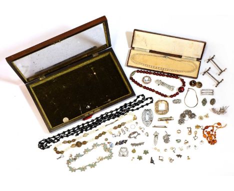 A jewellery box containing a small collection of gold, silver and costume jewellery,comprising a gold spectacle brooch, teste