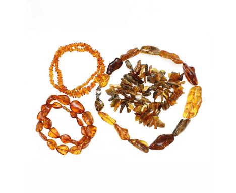 A group of amber and copal bead necklaces,to include a graduated free form clarified amber bead necklace, with elongated clar