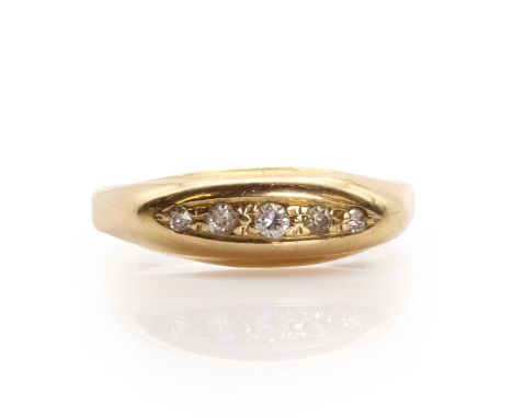 A gold five stone diamond ring, with a line of brilliant cut and eight cut diamonds, grain set to a plain curved boat shape m