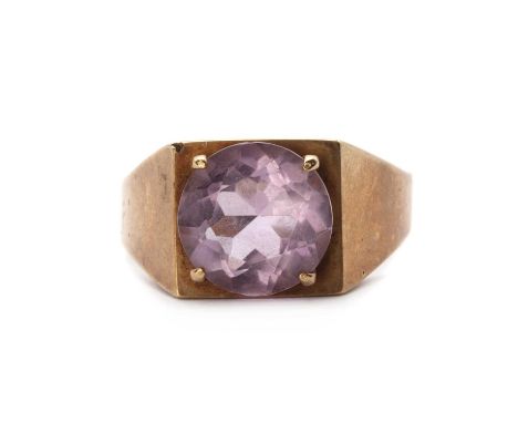 A 9ct gold single stone amethyst ring, c.1970, a round mixed cut amethyst, approximately 10mm, claw set to the square head, t