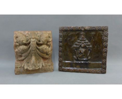 Carved wooden wall shelf / plaque and a treacle glazed terracotta plaque with a Buddhist style figure, 23cm (2) 