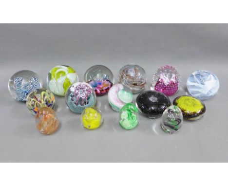 Collection of fifteen glass paperweights to include Caithness, Selkirk and Pfeiffer, etc and a Kosta Boda glass candlestick (