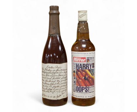 A bottle of 'Daily Mirror' Famous Grouse whisky and a bottle of Booker Noe's Kentucky Bourbon Whiskey, bottled by James B. Be