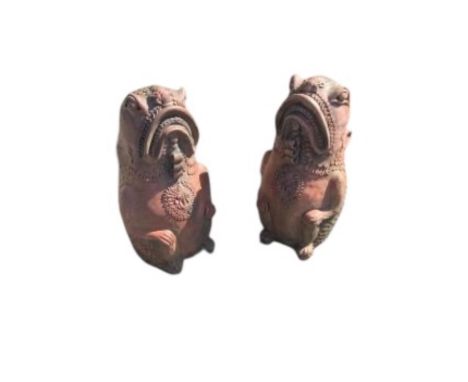 A pair of cast terracotta Oriental fish garden ornaments, height 61cm