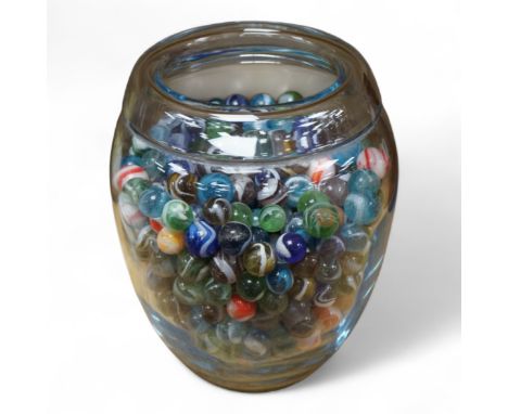 A glass vase possibly by Holmgaard, containing a large collection of late 19th/early 20th century glass marbles, 19cm high