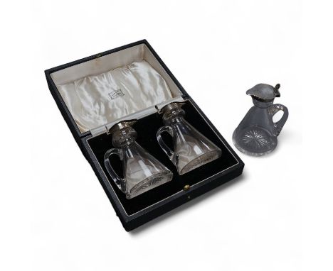 A cased pair of George V silver mounted glass whisky noggins, by S. Blanckensee &amp; Sons, Birmingham, 1935, height 10.5cm, 
