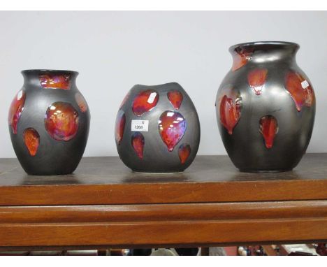 Poole Pottery Black Lustre Ovoid Shaped Vase, with random red splash motifs, 24cm high, two others similar smaller (3).No chi
