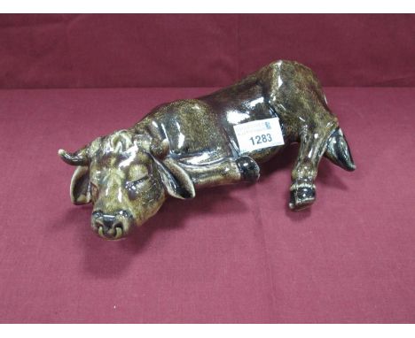 Anita Harris Figure of a 'Lying Cow' (part overhangs on shelf) gold signed, 22cm long.