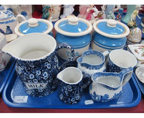 Three T.G Green Cornishware Storage Jars, black back stamp, Burleigh Calico milk jug. two Spode blue and white jugs:- One Tra