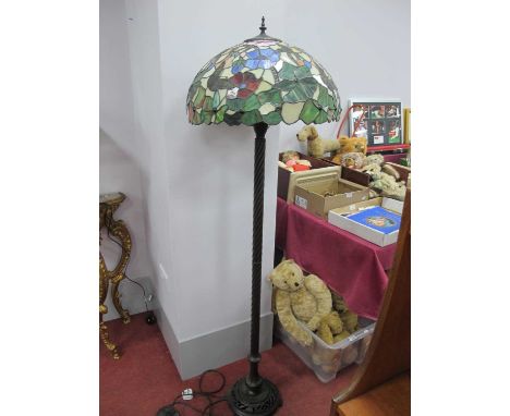 Tiffany Style Standard Lamp, in bronzed metal, of wrythen form, pierced circular base, butterfly themed shade.A few panels wi