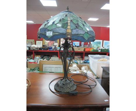 Tiffany Style Table Lamp, with twin branches, and dragonfly themed shade. A few glass panels with cracks, no missing panels