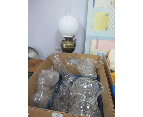Late XIX Century Brass Oil Lamp, with opaque shade; together with a collection of spare glass shades and chimneys:- One Box.