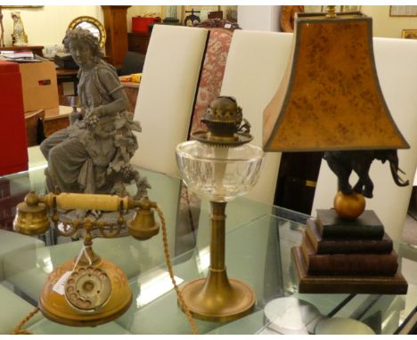 A novelty table lamp, featuring a standing Indian elephant, on a ball and stacked books&nbsp; 24"h; a brass oil lamp with a b