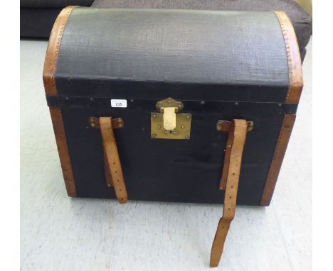 A late 19thC GD Peterkin black canvas and studded brown hide trunk with a lockable brass clasp and buckled straps, the domed 