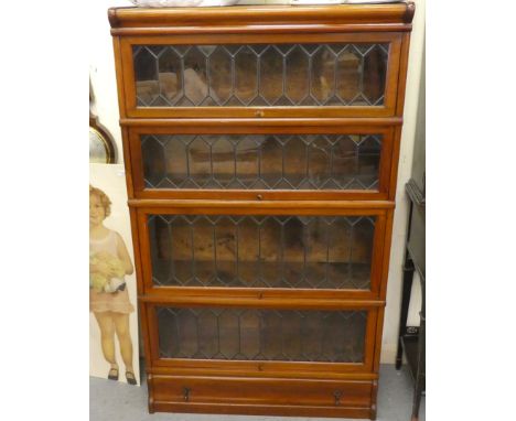 A mid 20thC mahogany Globe Wernicke lead glazed four section bookcase, on a plinth&nbsp; 58"h&nbsp; 34"w&nbsp; 