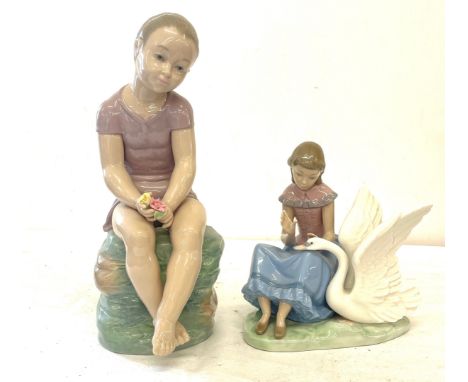 Nao large girl figure, sitting on rocks, girl figure with swan, both in good overall condition 