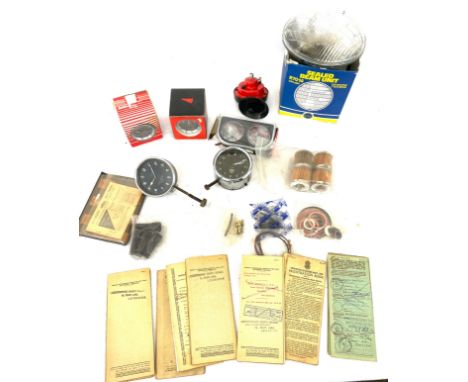 Selection of vehicle registration books, Smith clock, dial etc 
