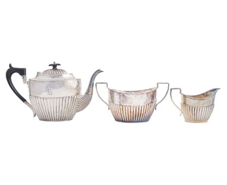 A Victorian silver three-piece tea service, teapot 16.5cm, by Barker Brothers, Birmingham 1894, 29ozs Light wear, engraved wi