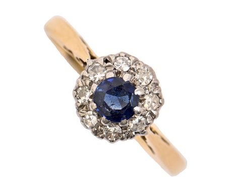 A sapphire and diamond cluster ring, gold hoop marked 18ct PLAT, head 8mm diam, 2.5g, size M Good condition