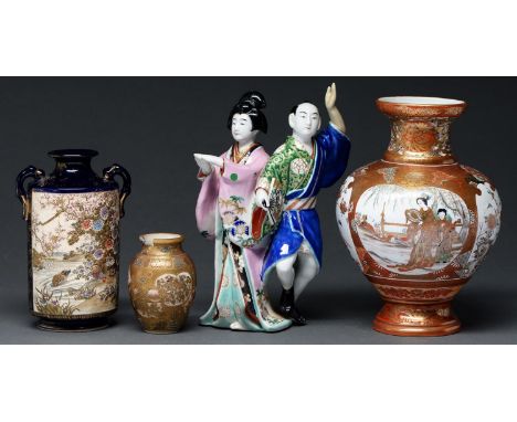 A Japanese Satsuma cylindrical vase, Meiji period, enamelled and gilt with two panels of birds before a waterfall or by a riv