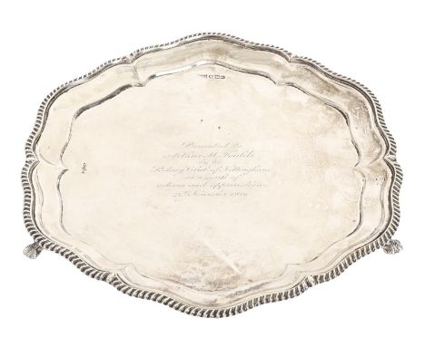 A George V silver salver, with gadrooned rim on three claw and ball feet, 26.5cm diam, by Walker &amp; Hall Ltd, Sheffield 19