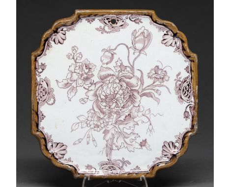 A Dutch Delftware plaque, late 18th c, shaped square with moulded integral frame and painted in manganese with flowers, 25 x 