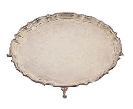 A George V silver salver, on four hoof feet, 26cm diam, by Barker Brothers Silver Ltd, Birmingham 1927, 17ozs 6dwts Good cond